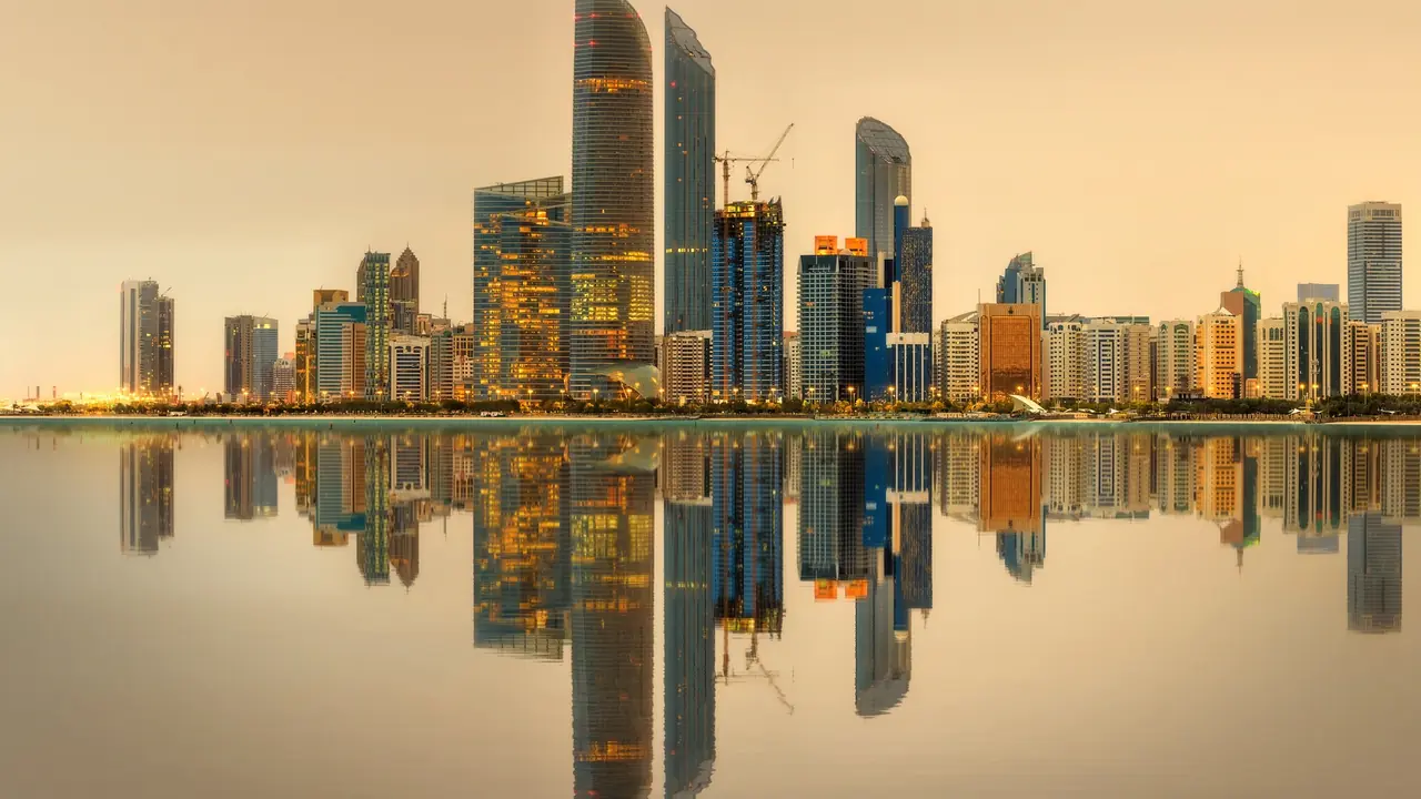 Abu Dhabi waterfront skyline in golden evening light