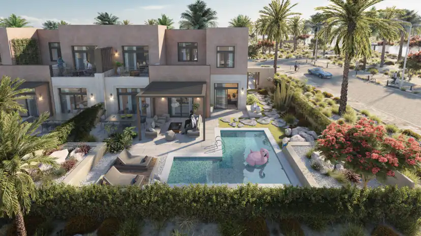 Rendering of a two-story house with terracotta walls and a rear patio, a rectangular pool with a pink inflatable flamingo, lounge chairs, palms and a flowering red shrub.
