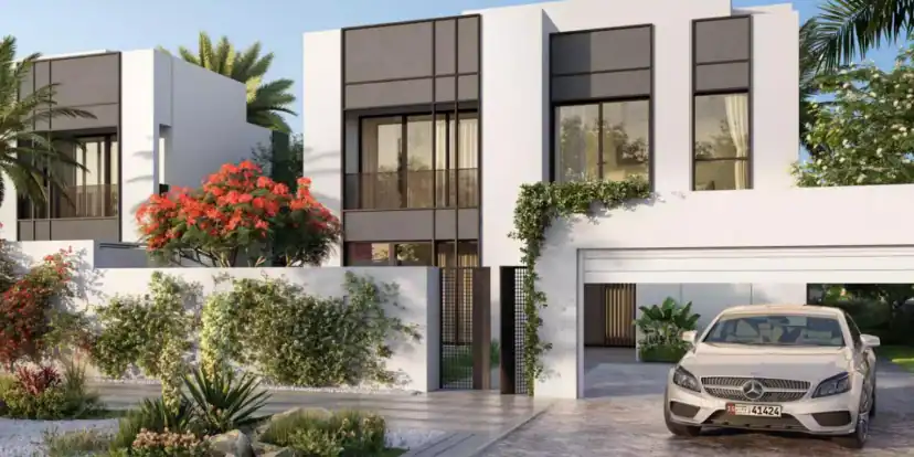 Rendering of a white two-story house with a covered garage where a silver car is parked, with a red flowering tree and green plants at the front wall.