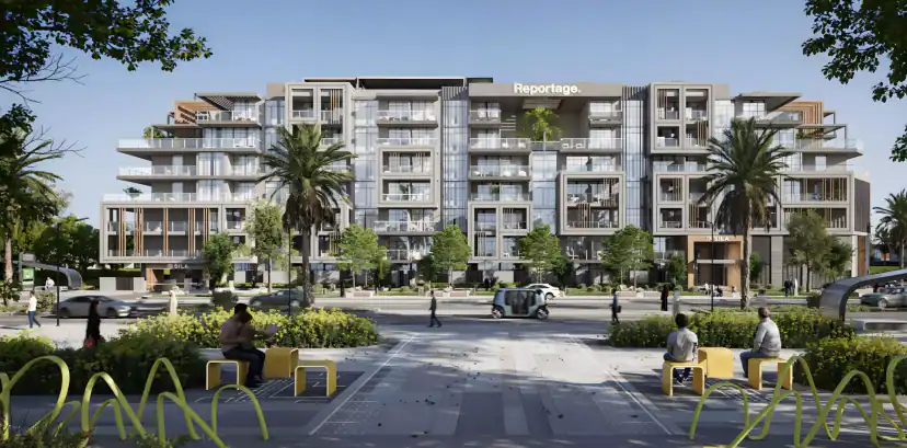 Rendering of a multi-story apartment building with glass balconies behind a paved plaza, with palm trees, yellow benches, seated people and a small vehicle.