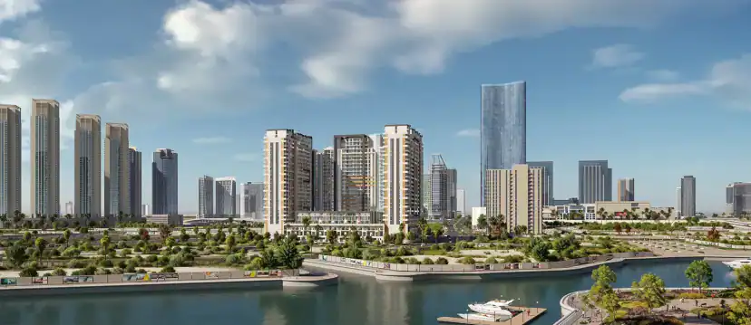 Rendering of a waterfront district with apartment towers, green landscaped areas and a boat dock, with taller glass towers in the background under a cloudy sky.