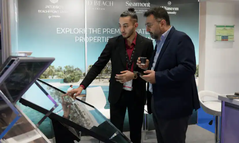 Two Masterpiece Property advisors presenting a project at our stand