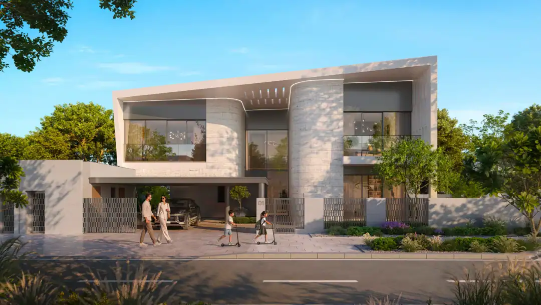 A Talay villa with its curved facade on a quiet street at Marsa Al Saadiyat, with a family walking past